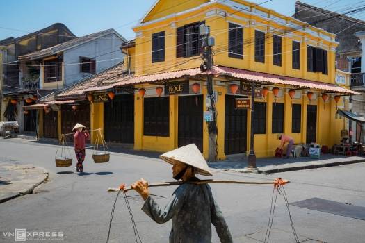 Street vendors with shoulder pole a familiar sight in Vietnam's old town